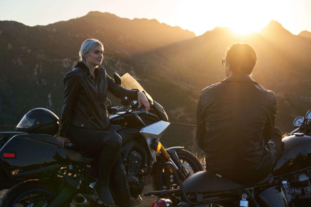 a pair of bikers take a break