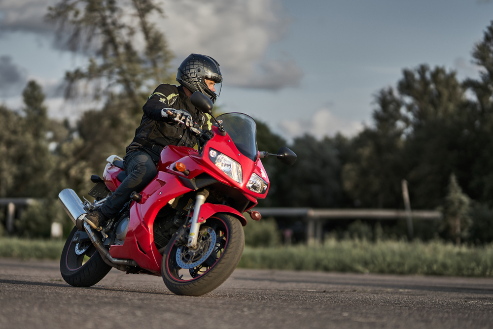man on a red motorcycle