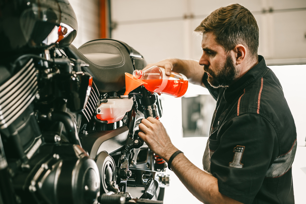 mechanic repairing a motorcycle